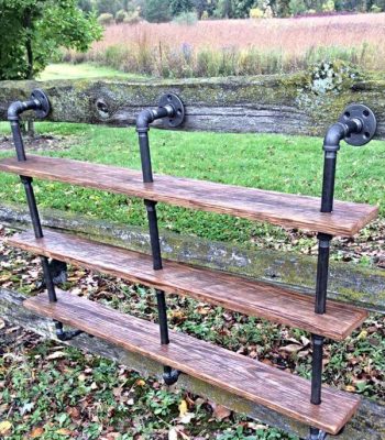 repurposed pallet and iron pipe triple shelf