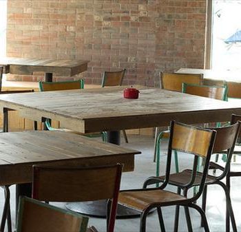 reclaimed pallet and single metal leg tables